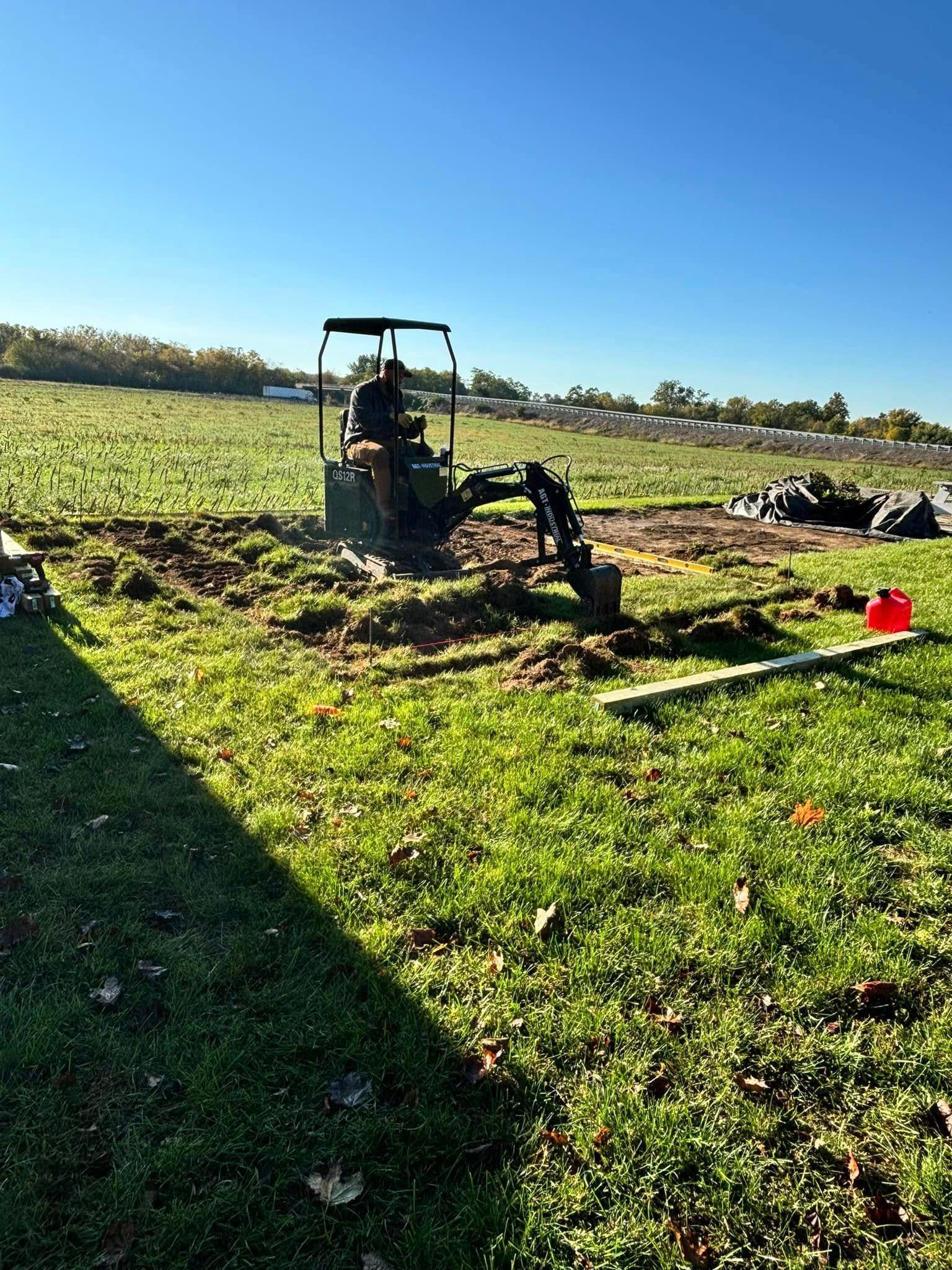 Excavator digging a deep trench for utilities