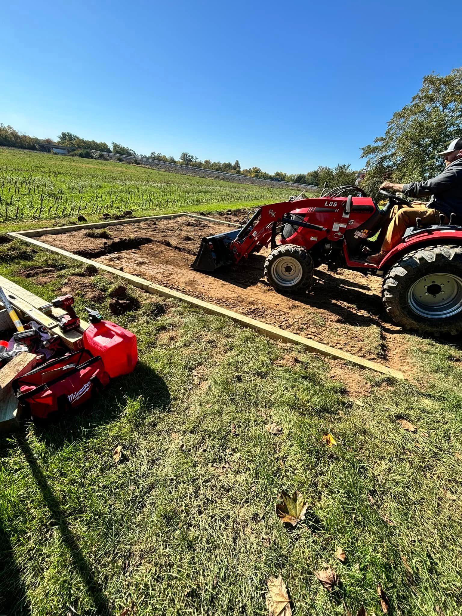 Tractor working dirt at a residential construction site